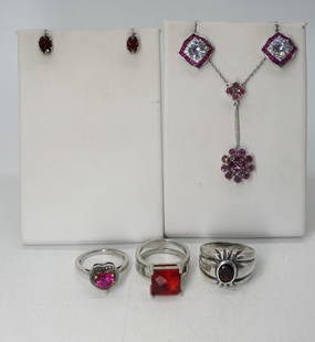 RUBY RED GEMSTONE, STERLING LOT: 3 STERLING RINGS WITH RUBY COLORED GEMSTONES, SIZES 7-8. TWO PAIR OF PIERCED STERLING RUBY COLORED GEMSTONE EARRINGS. ONE RUBY GEMSTONE NECKLACE, 18". 16 DWT
