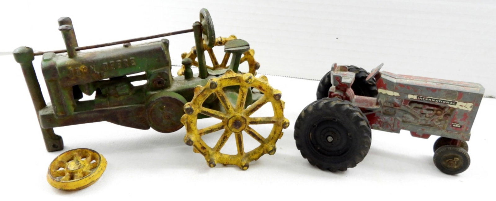 JOHN DEER CAST IRON ANTIQUE TRACTOR: for repair PLUS INTERNATIONAL ERTL TRACTOR