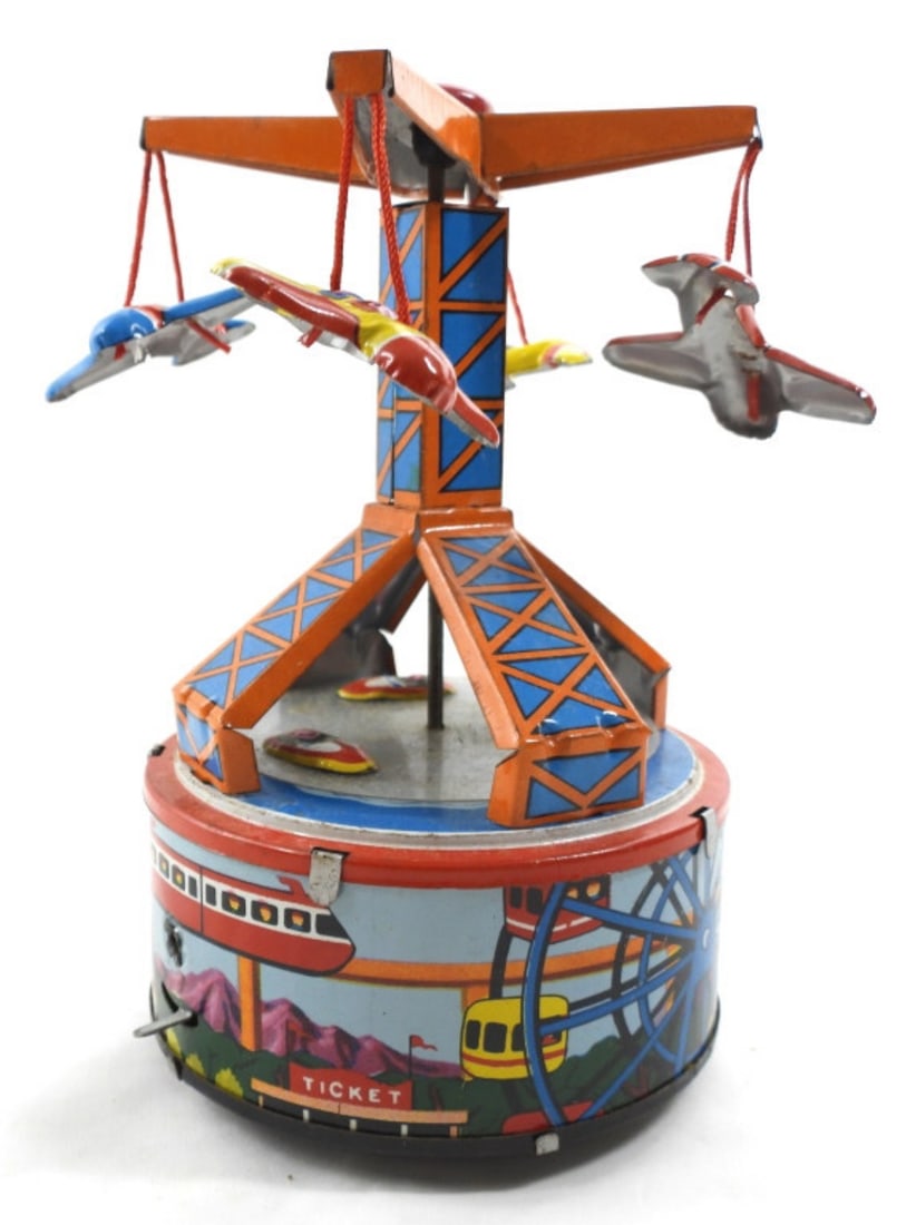 1960'S WIND UP CARNIVAL IN ITSELF TIN TOY: VINTAGE 1960'S WIND UP CARNIVAL IN ITSELF- PLANE AND BOAT RIDE - IT DOES WORK IN GOOD CONDITION. PREOWNED.