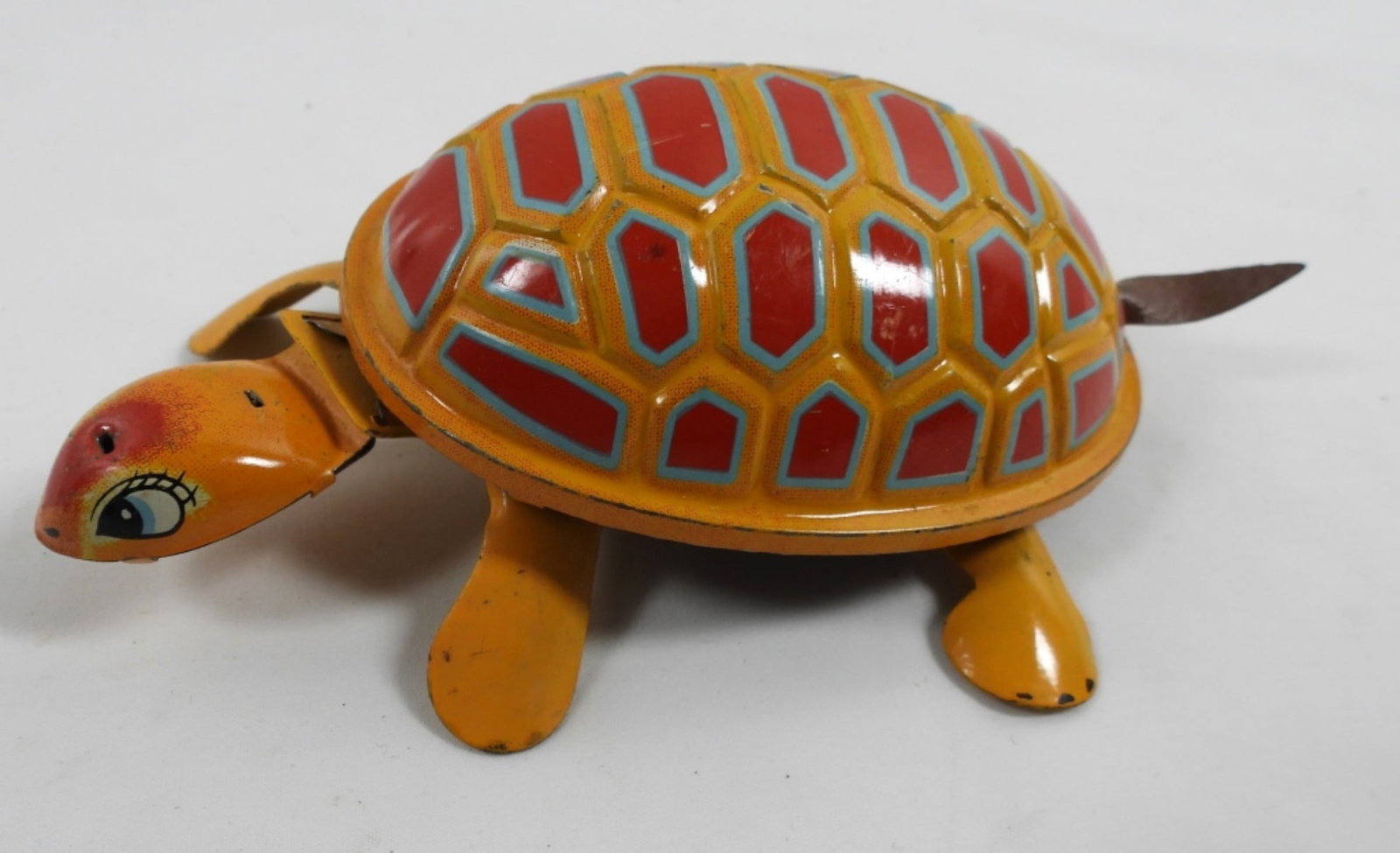 VTG WIND UP TIN TURTLE: VINTAGE WIND UP TIN TOY- TRADE K MARK MADE IN JAPAN. HE HAS HIS ORIGINAL COLORS BUT HE IS MISSING HIS HAT. HE DOES WIND UP AND THE LEGS MOVE, BUT WHEN U SET HIM ON A SURFACE HE DOESN'T MOVE ANYWHERE .