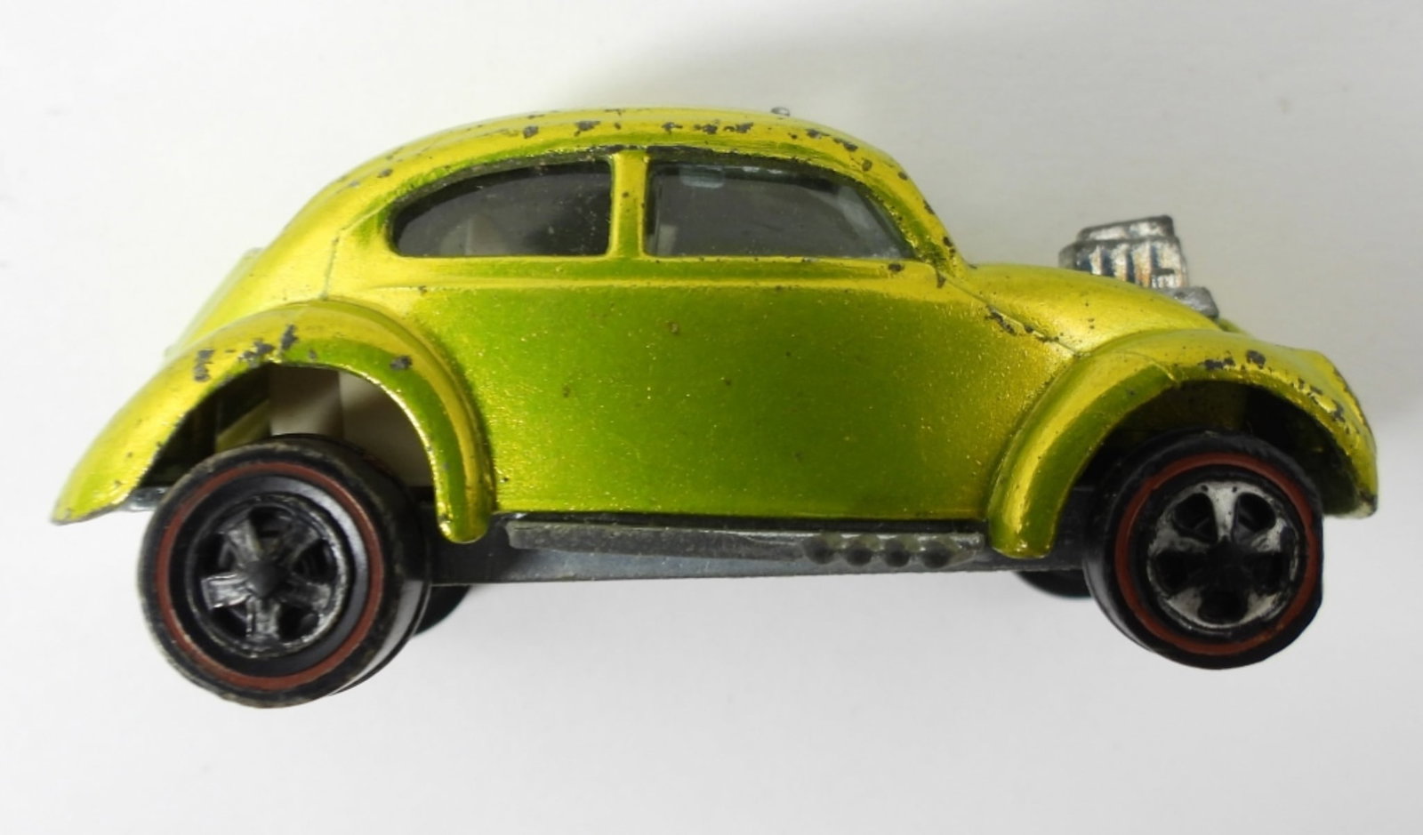 1969 HOT WHEELS CUSTOM VOLKSWAGEN: 1969 CUSTOM VOLKSWAGEN REDLINES GREEN-YELLOW- IN GOOD CONDITION DOES SHOW SOME WEAR IN THE PAINT ON THE BODY. THE SUNROOF IS MISSING THE ONE CORNER BUT STILL OPENS AND CLOSES. PREOWNED.