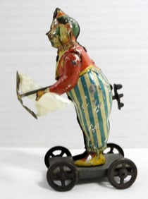 ANTIQUE WIND-UP CLOWN TIN TOY