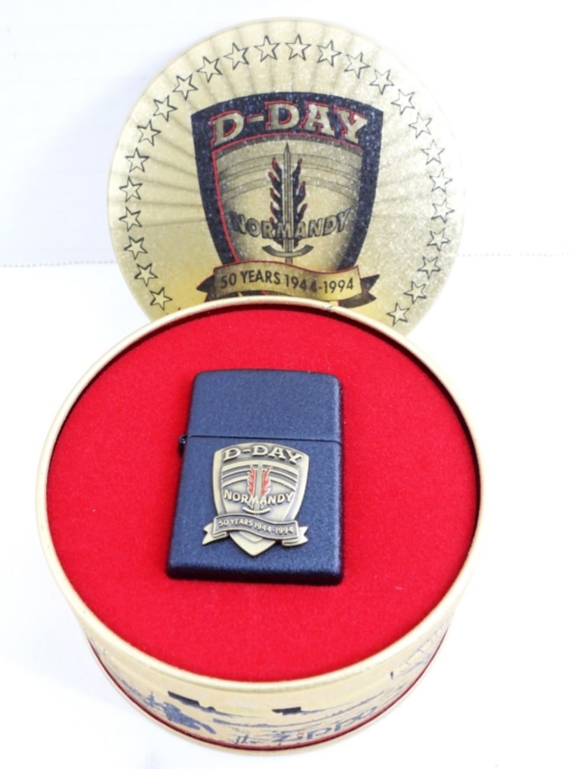 1994 D-DAY EDITION ZIPPO: 1994 D-DAY EDITION ZIPPO WITH THE D-DAY TIN- THE ZIPPO IS SEALED & UNFIRED. IN GOOD CONDITION- PREOWNED.