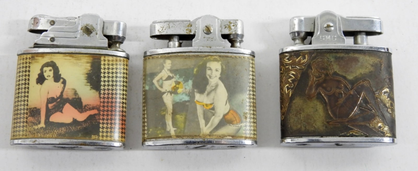 (3) RISQUE PIN-UP VINTAGE LIGHTERS: (1) HAND ETCHED (2) COLORED SWIM SUIT STYLE - ALL USED