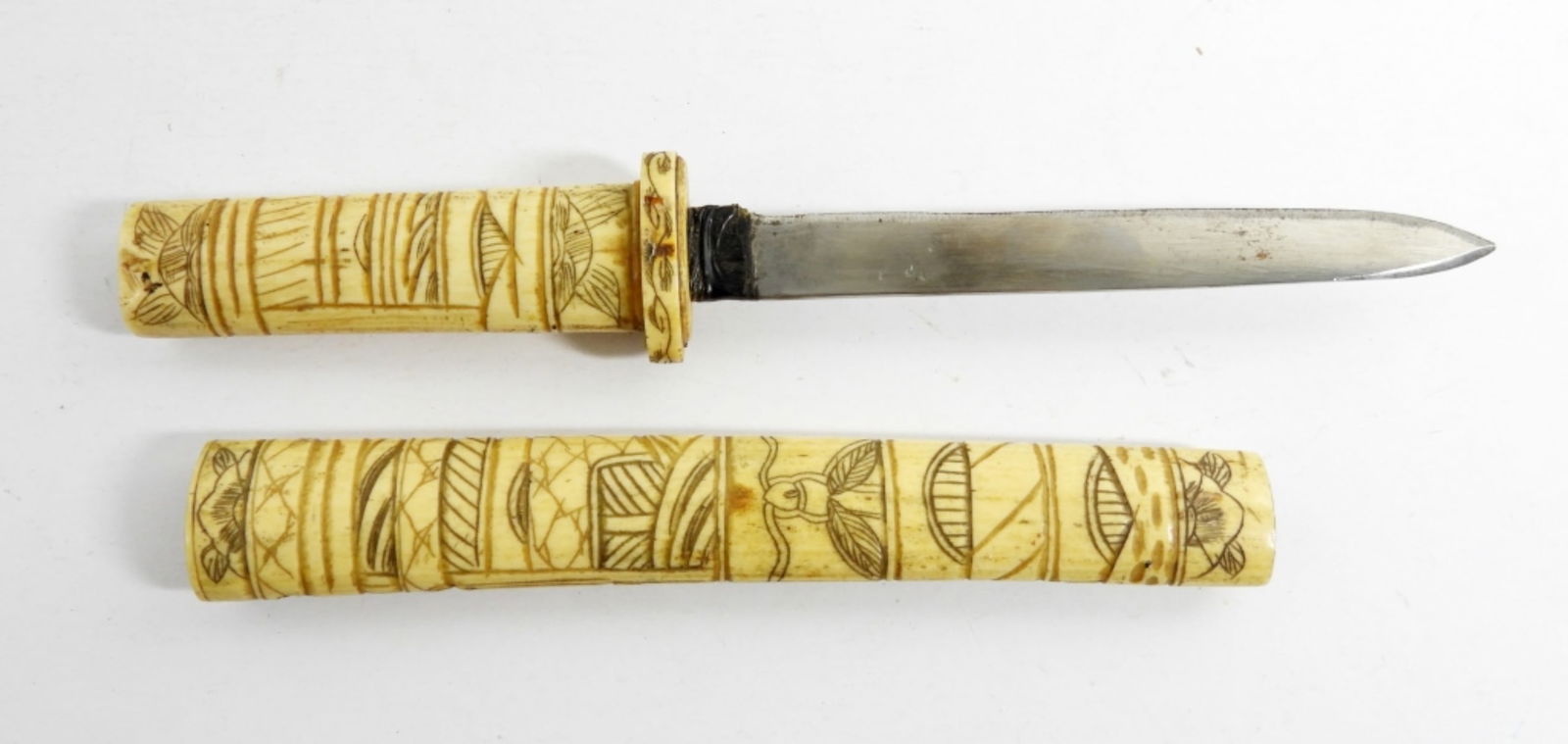 ANTIQUE JAPANESE 19TH CENTURY SWORD: VINTAGE 19TH ERA- JAPANESE SHORT SWORD- THE HANDLE AS WELL AS THE COVER IS MADE FROM BONE DOES SHOW WEAR- THE SWORD IS WORN DOWN AND IT LOOKS LIKE SOMEONE HAD TRIED TO SHARPEN IT AT ONE POINT. THERE I