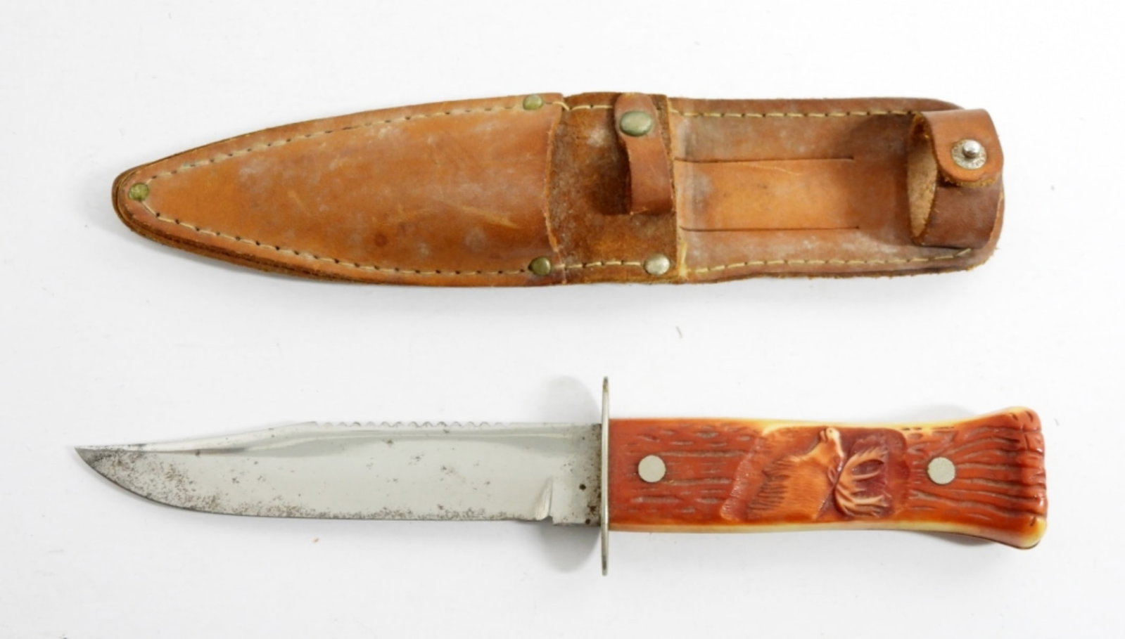 IMPERIAL HUNTING KNIFE CARVED HANDLE: VINTAGE HUNTING KNIFE- IMPERIAL- THE HANDLE OF THE KNIFE HAS A ELK ENGRAVED INTO IT. IN GOOD CONDITION THE KNIFE DOES SHOW SOME WEAR, COMES WITH CARRYING CASE-DOES SHOW WEAR ON THE CASE. PREOWNED.