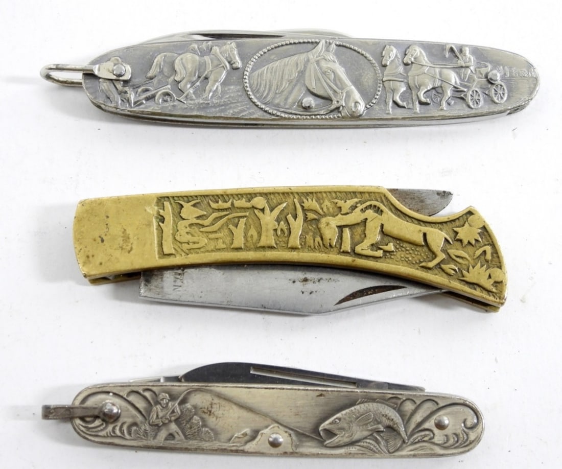 (3) METAL EMBOSSED DESIGNED KNIFE LOT: (1) HORSE DETAILS (1) TRIBAL AZTEC? (1) FISHING