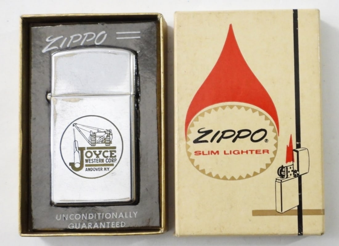 1975 FIRED SLIM ZIPPO IN ORIGINAL BOX: 1975 FIRED SLIM ZIPPO IN ORIGINAL SLIM LIGHTER BOX. JOYCE WESTERN CORP. LOGO