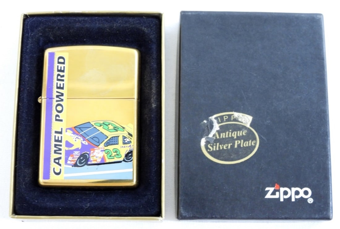 1997 CAMEL POWERED ZIPPO: 1997 CAMEL POWERED ZIPPO- FEATURES A RACE CAR ON THE FRON #23-IN GOOD CONDITION. SEALED-UNFIRED.- PREOWNED.