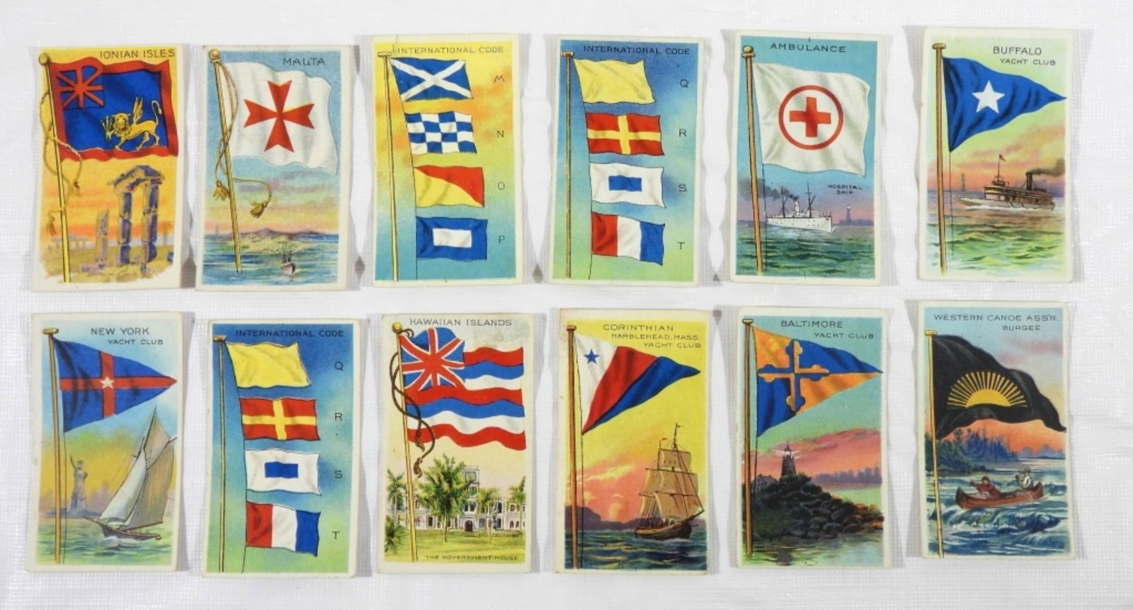 (12) 1909-1911 T-59 FLAGS OF ALL NATIONS: 1909-1911 T-59 FLAGS OF ALL NATIONS- RECRUIT- WESTERN CANOE ASS'N BURGEE, BALTIMORE, CORINTHIAN, HAWAIIAN, INTERNATIONAL CODE, NEW YORK, BUFFALO, AMBULANCE, INTERNATIONAL CODE, IONIAN ISLES, MALTA, IN