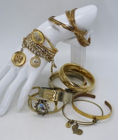 (10) GOLD TONE BANGLE BRACELETS +