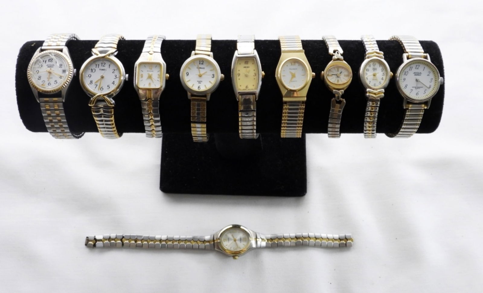 (10) SILVER & GOLD TONE WATCHES LOT: 10 WOMEN'S SILVER & GOLD TONE WATCH LOT. 1- OF THE WATCHES HAS A BROKEN BAND MAYBE ABLE TO BE REPAIRED OR COULD BE USED FOR REPAIRS. SOME OF THE BRANDS ARE CARRIAGE, PULSAR, TIMEX, ARMITRON- THESE BRA