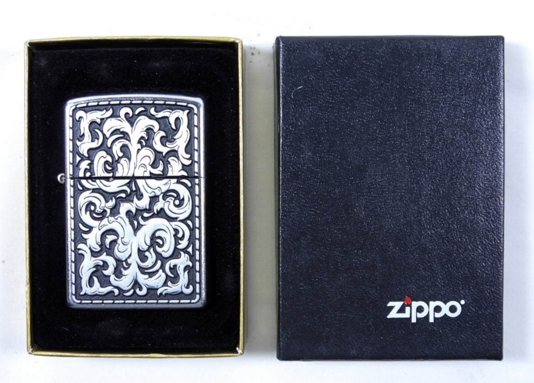 2009 ZIPPO-SEALED-UNFIRED: 2009 ZIPPOS SEALED UNFIRED- IN GOOD CONDITION- HAS A STUNNING DESIGN ON THE FRONT OF THE ZIPPO- DOES SHOW SOME WEAR, PREOWNED.
