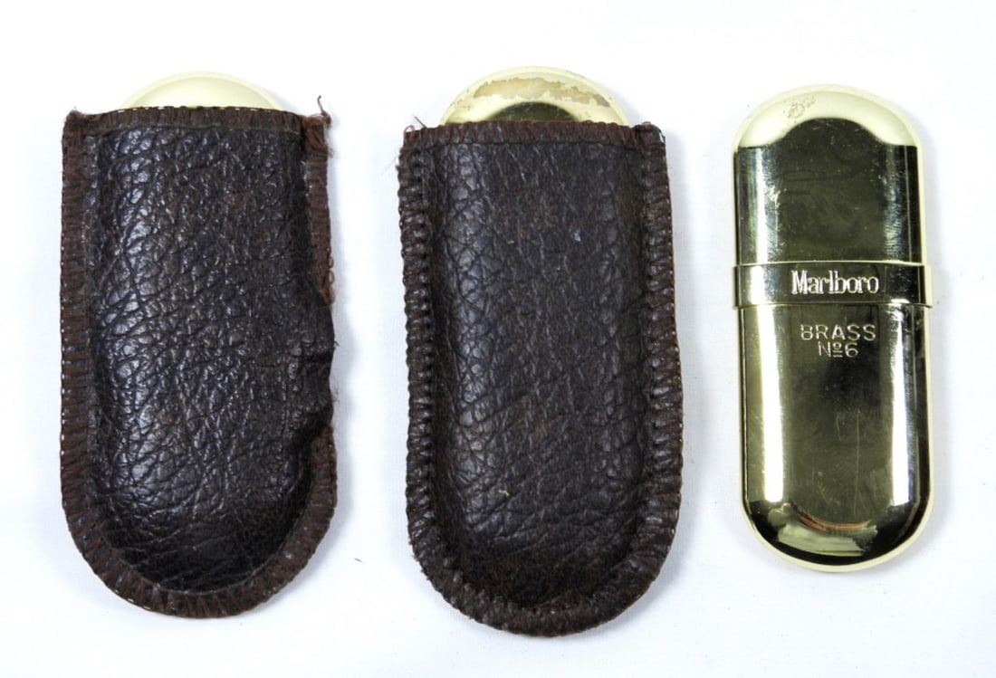(3)- VTG MARLBORO NO. 6- LIGHTER: 3 VINTAGE MARLBORO- GOLD TONED- LIGHTERS- 2-ARE UNFIRED- 1- IS FIRED. IN GOOD CONDITION DOES SHOW SOME WEAR, PREOWNED. TWO OF THE LIGHTERS COME WITH BAGS.