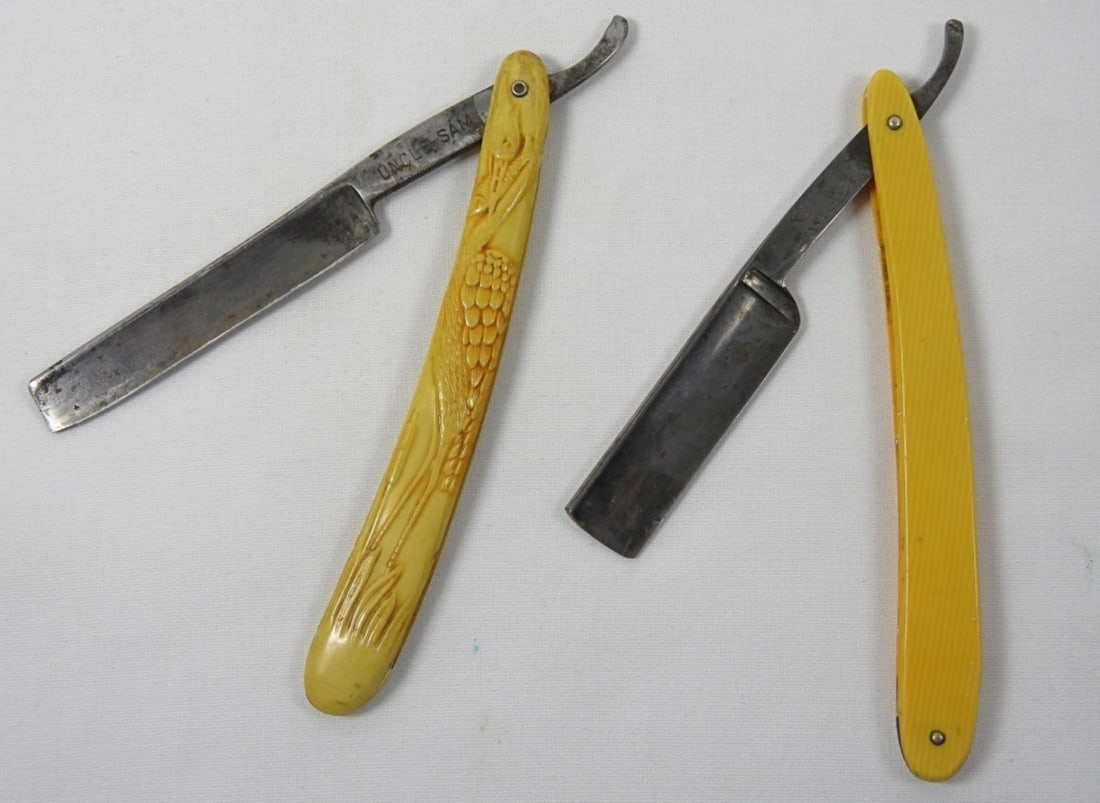 YELLOW VINTAGE RAZOR LOT (2): 2 VINTAGE YELLOW HANDLE RAZORS: GENCO ARMY AND NAVY RAZOR, AND UNCLE SAME GERMANIA CUTLERY WORKS GERMANY RAZOR.