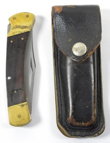 BUCK 110 FOLDING KNIFE IN SHEATH