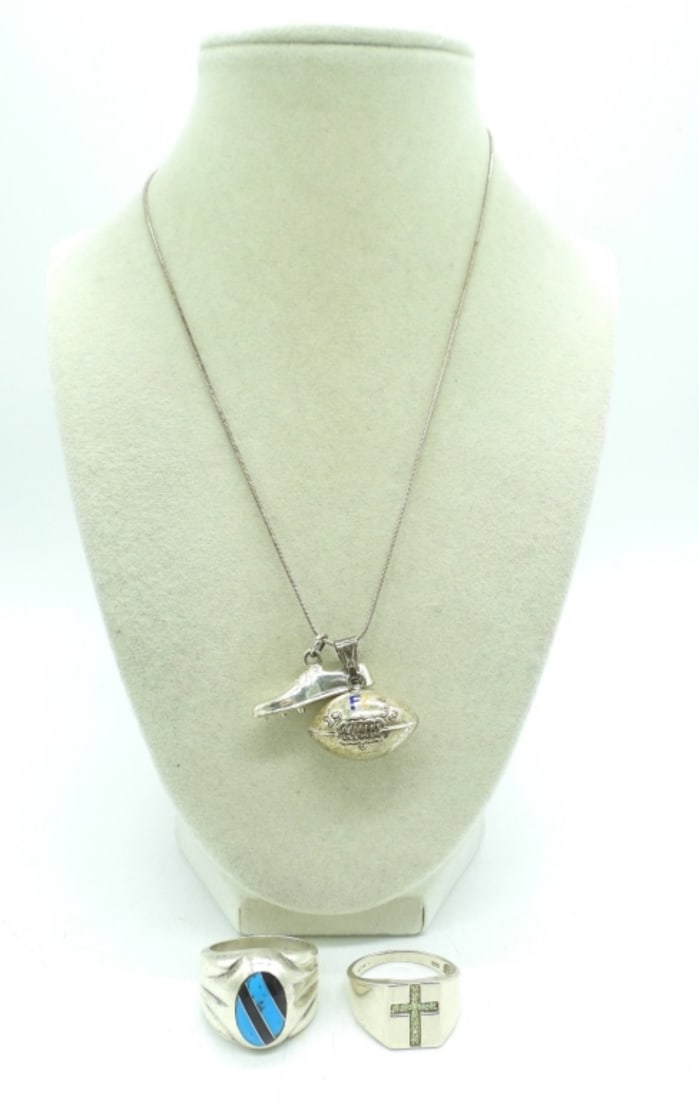 STERLING RINGS & SPORTS NECKLACE: TWO STERLING MEN'S RINGS, SIZES 12 & 13. STERLING FOOTBALL & TRACK SHOE PENDANTS ON A STERLING 18" CHAIN. 26 DWT