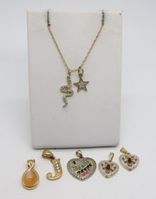 (7) STERLING GOLD TONE PENDANTS & CHAIN