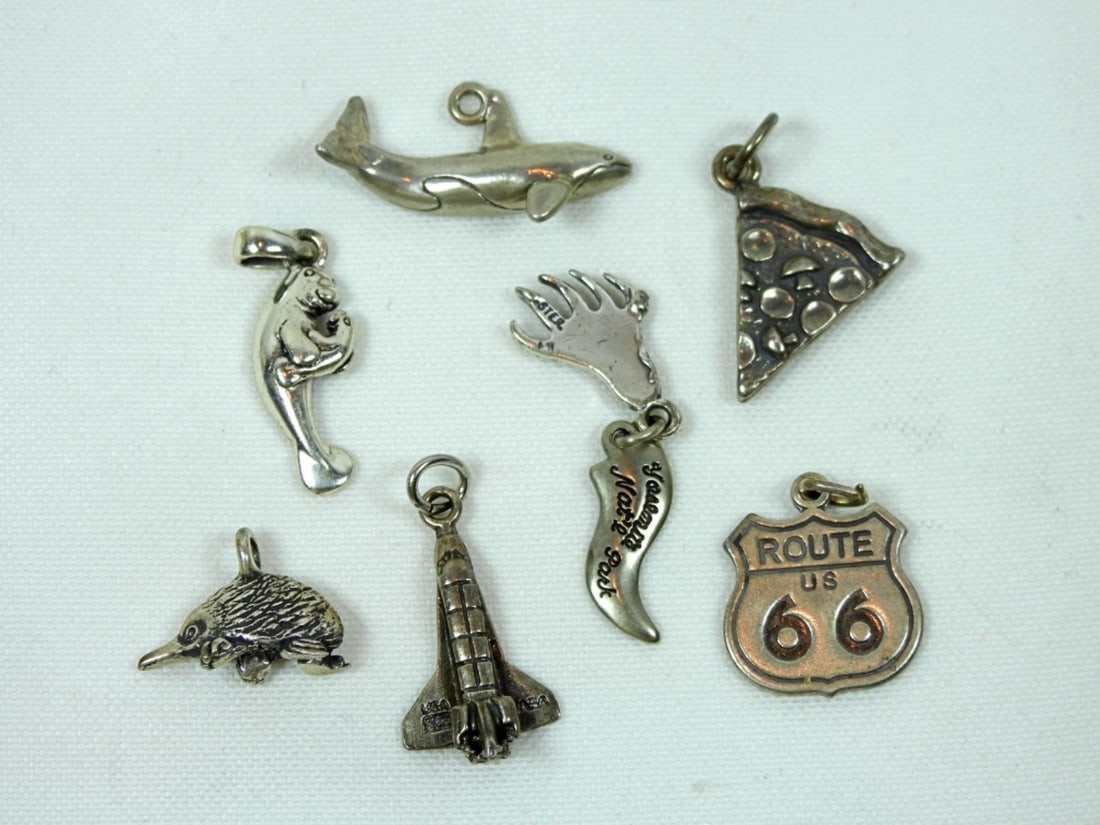 7 VARIETY STERLING PENDANTS: 7 VARIETY STERLING PENDANTS, ROUTE 66, DOLPHIN, OTTER, CLAW, PIZZA, SPACESHIP, HEDGEHOG, DWT (9.7)