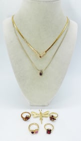 (7) GOLD TONE W/ PURPLE GEMSTONES