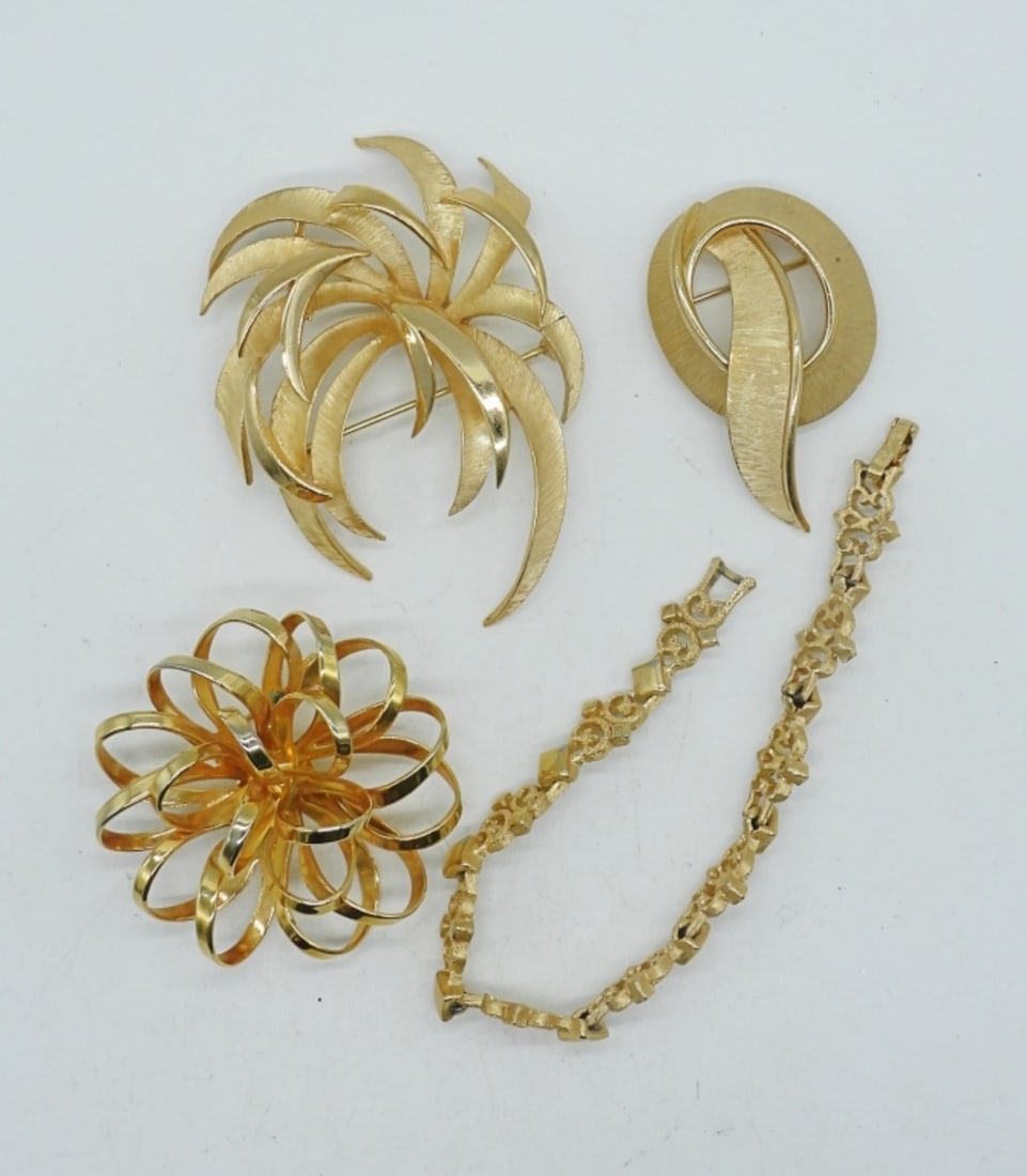 TRIFARI BROOCHES, AVON BRACELET: TWO TRIFARI GOLD TONE BROOCHES 2-3". ONE NO BRAND GOLD TONE BROOCH. AVON GOLD TONE BRACELET, 8".