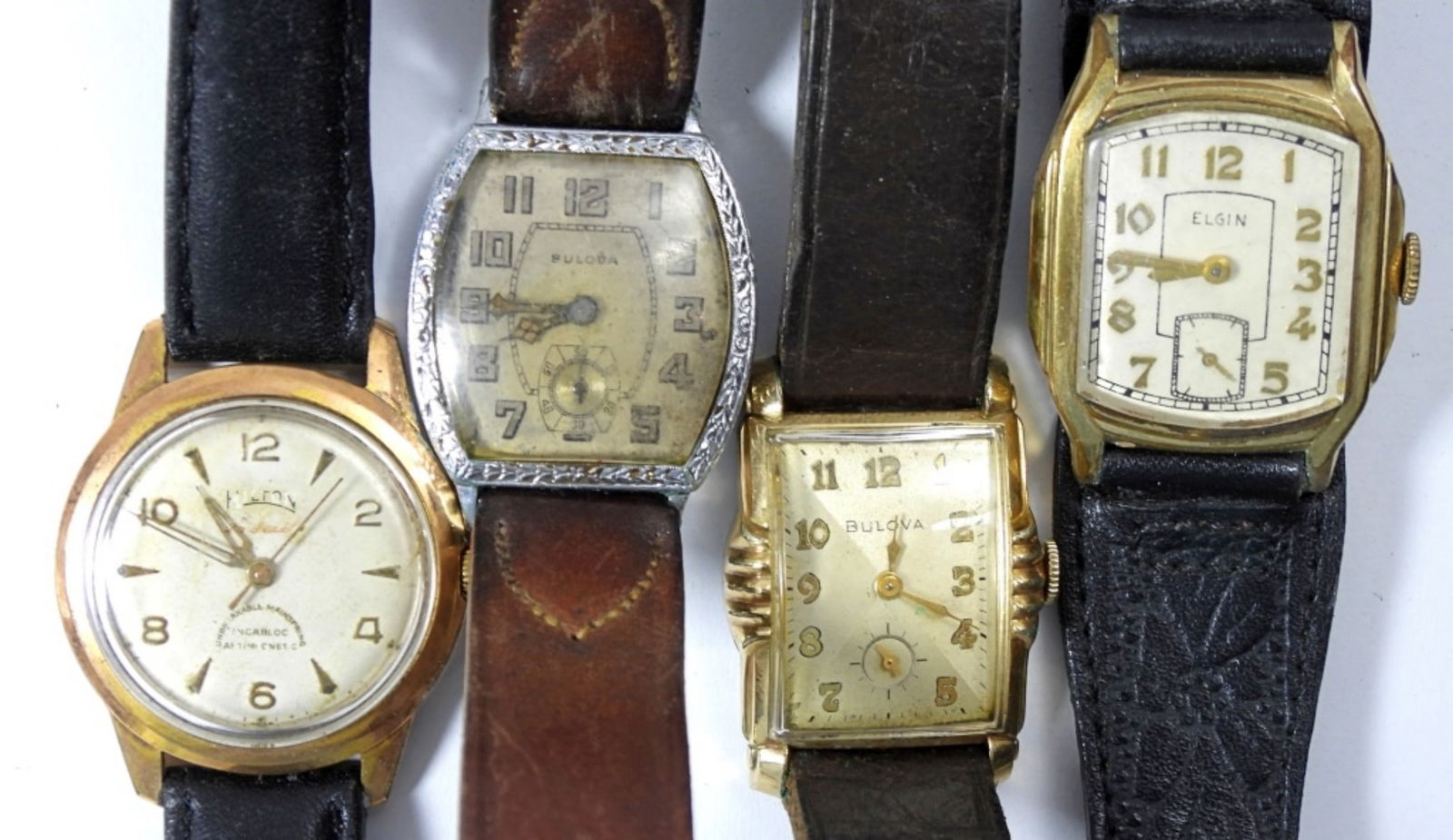 (4) VINTAGE WRIST WATCHES - WIND UP: BULOVA, ELGIN, HILTON all RUNNING needs serviced - (1) BULOVA NOT RUNNING PARTS