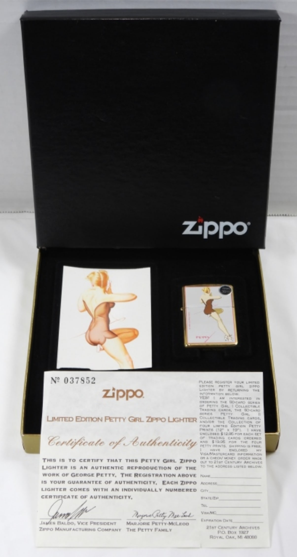 1997 UNFIRED PETTY GIRL MEMPHIS BELL ZIPPO: 1997, MEMPHIS BELL IN ZIPPO BOX, COMES WITH TRADING CARD, AND COA FROM ZIPPO NO.037852, REPRODUCTION OF THE WORK OF GEORGE PETTY
