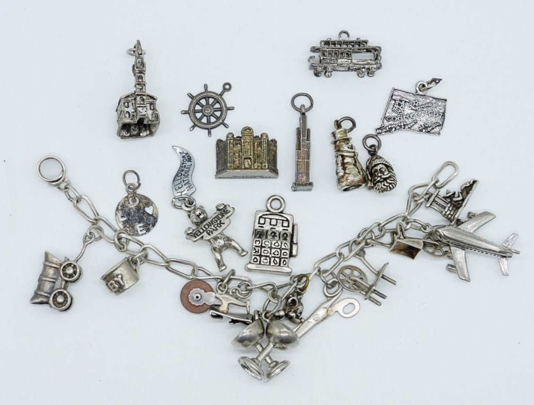 23 STERLING CHARMS: 23 STERLING CHARMS FOR A CHARM BRACELET, ON A BRACELET THAT NEEDS A REPLACEMENT CLASP AT BOTH ENDS! (32.4 DWT)