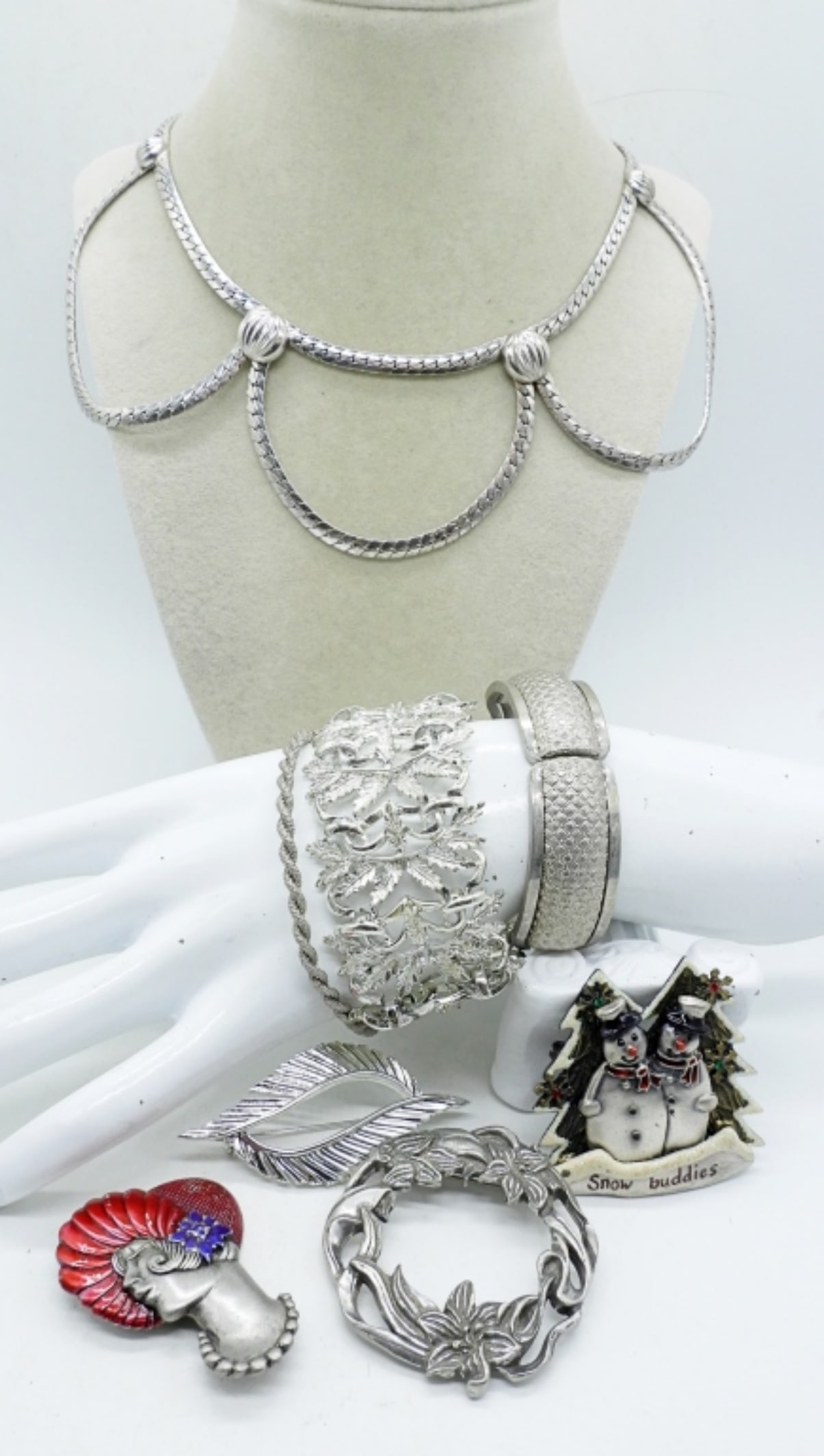 (8) SILVER TONE FASHION ACCESSORIES: NECKLACE, 15". FOUR PINS, 2-3". THREE BRACELETS, 6-7.5"