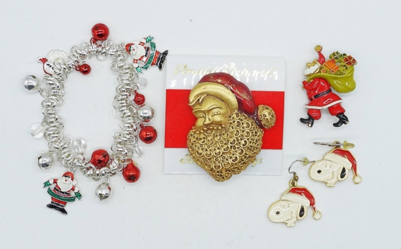VTG CHRISTMAS HOLIDAY JEWELRY: 1958 SNOOPY HOLIDAY EARRINGS, PIERCED. TWO SANTA PINS, 2-3". ONE STRETCHY HOLIDAY BRACELET WITH BELLS.