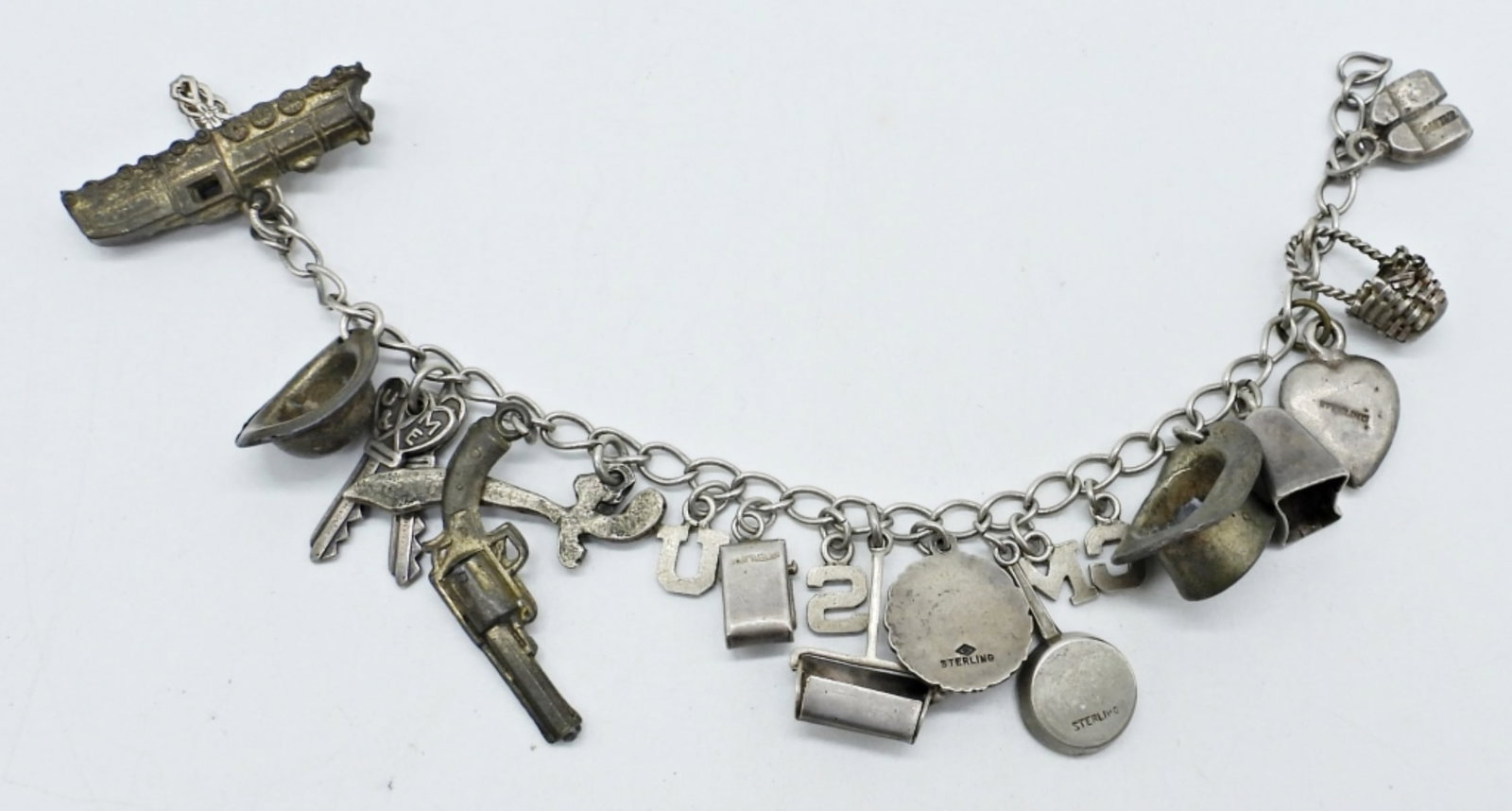 STERLING VINTAGE CHARM BRACELET: VINTAGE STERLING CHARM BRACELET, 7.5". 18 CHARMS. (19.2 DWT)