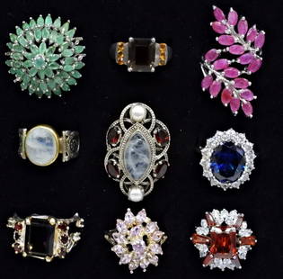 (9) STERLING RINGS. MOONSTONE, RUBY +: NINE STERLING FASHION GEMSTONE RINGS. MOST ARE PROBABLY SIMULATED STONES. RUBY, SAPPHIRE, MOONSTONE, JADE, SMOKEY QUARTZ & MORE. SIZES 7-9. A FEW SMALL MISSING GEMSTONES. (35 DWT)