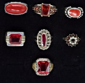 (7) STERLING VARIOUS RED GEMSTONE RINGS