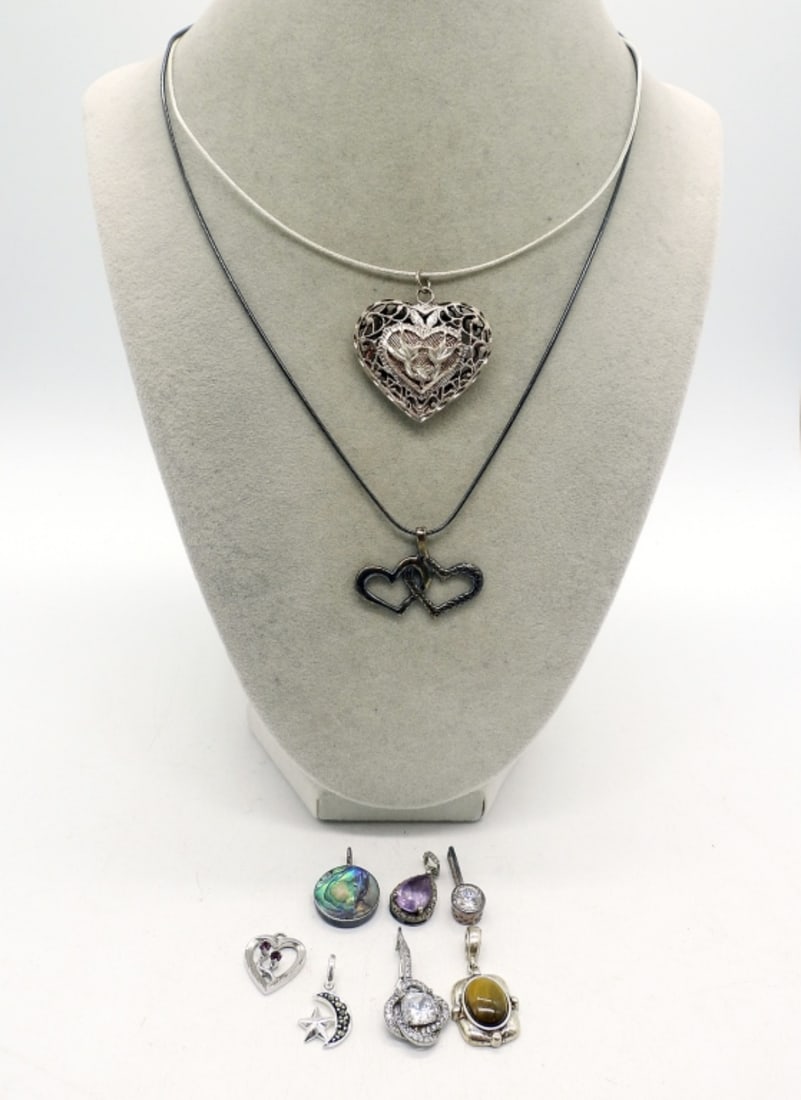 STERLING FASHION PENDANTS & CHAINS: NINE STERLING FASHION PENDANTS. .5" - 1". STERLING CHAINS ARE 16" & 18". (19 DWT)
