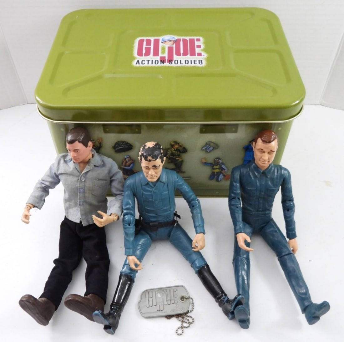 VINTAGE COLLECTABLE GI JOE TIN & 3 FIGURES: VINTAGE 1998 COLLECTABLE GREEN GI JOE ACTION SOLDIER TIN, SIZE 13-3/4" LONG X10" WIDE X7-1/2 TALL.VINTAGE 1960S MARX DOUBLE AGENT MIKE HAZARD,VINTAGE 1964 BROWN HAIR GI JOE WITH SCAR ON FACE, VINTAGE 