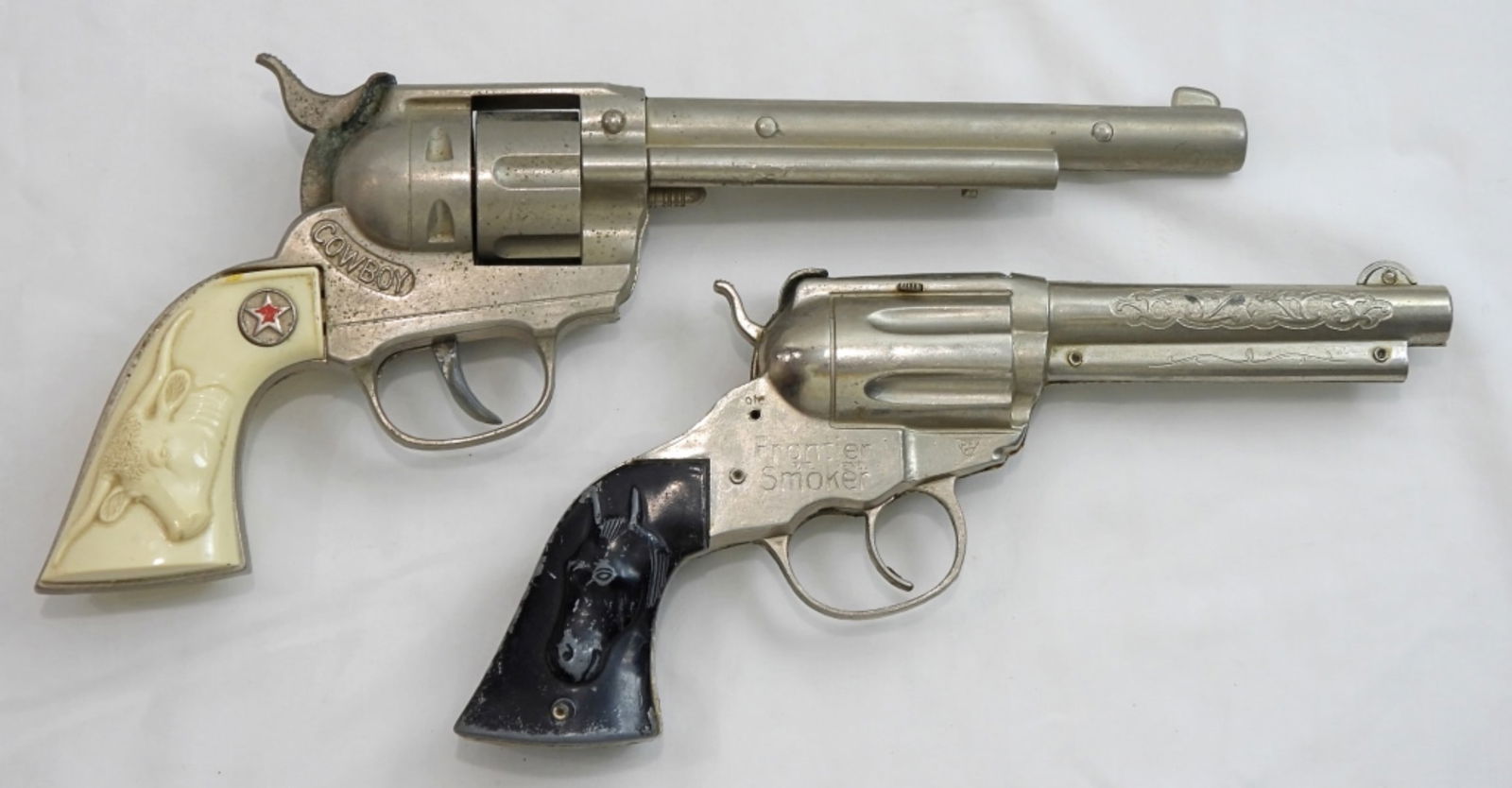 (2) TOY CAP GUNS - HUBLEY & FRONTIER: 12" COWBOY HUBLEY & 9 1/2" FRONTIER SMOKER - BOTH WORKING CONDITION