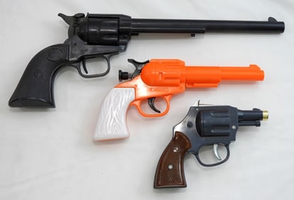 (3) PLASTIC TOY CLICKING PISTOLS / GUNS