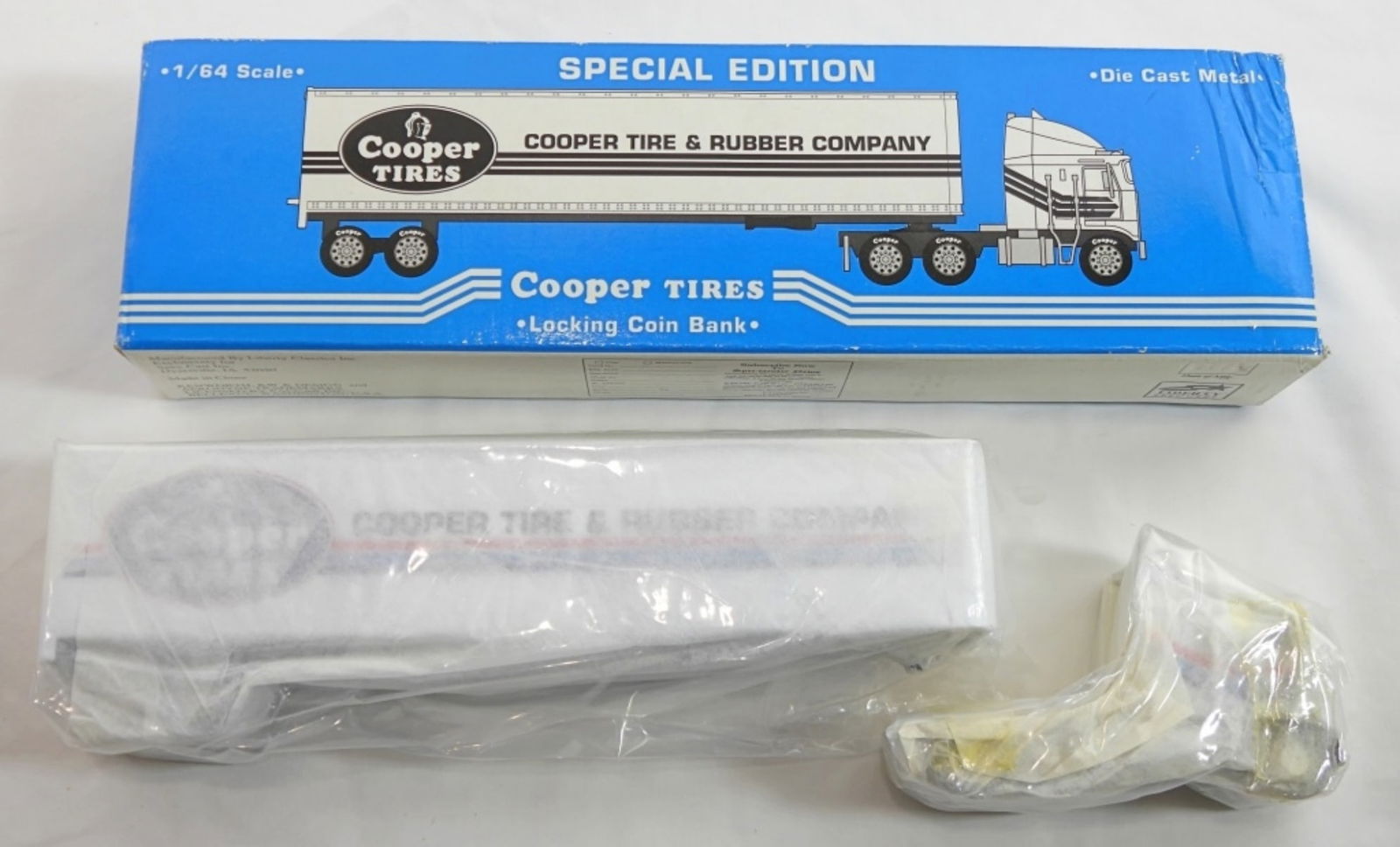 COOPER TIRES KENWORTH K100E LOCK COIN BANK: IN ORIGINAL BOX, SEMI IS STILL WRAPPED IN BOX, SPECIAL EDITION, 1/64 SCALE, LOCKING COIN BANK, COPPER TIRES KENWORTH K100E