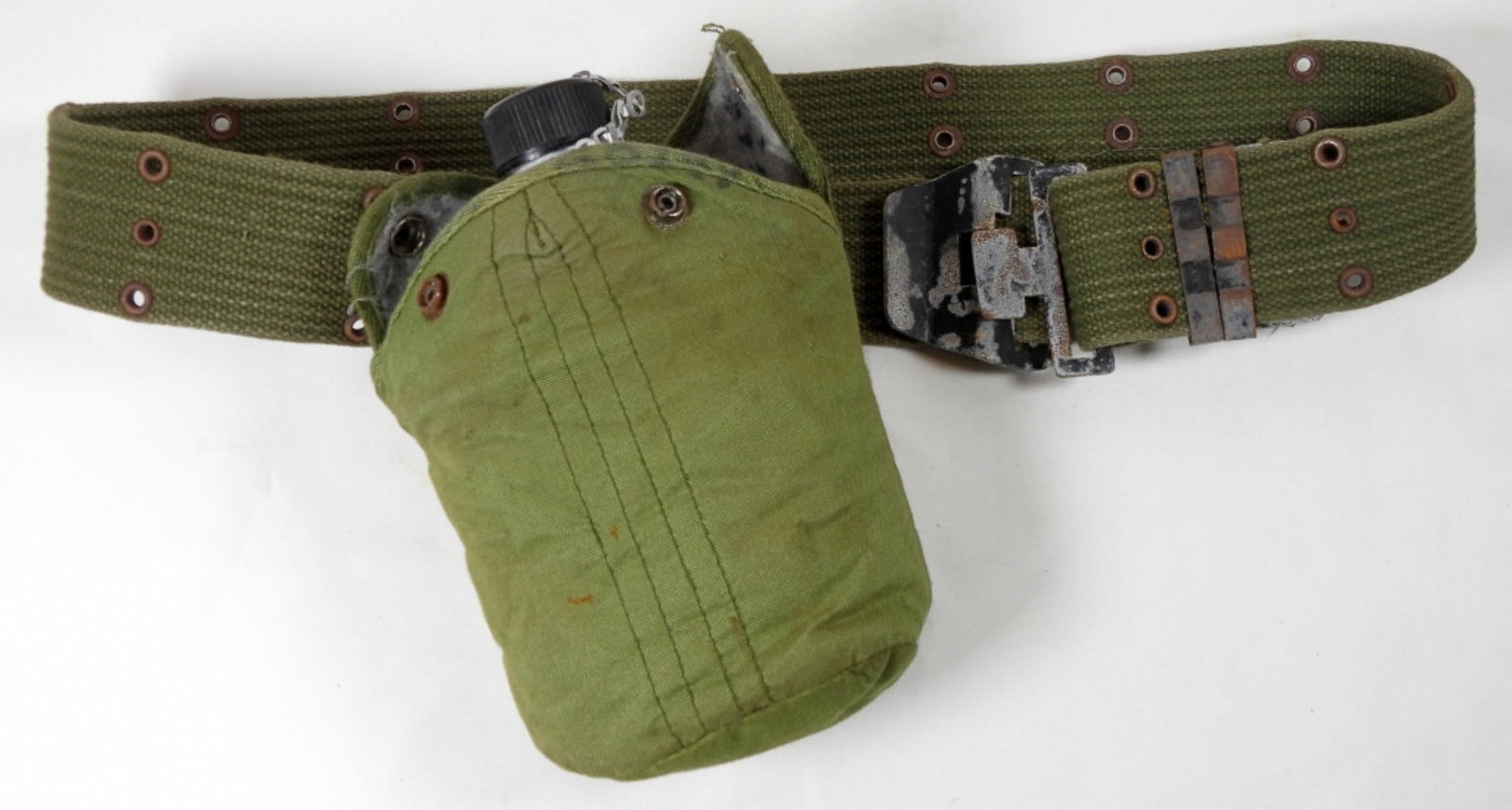 VINTAGE MILITARY CANVAS BELT ALUMINUM CANTEEN: NORMAL WEAR DOES HAVE SOME STAINS, WRITING ON THE INSIDE WITH THE NAME DAN. THE CANTEEN HAS SOME MINOR DINGS