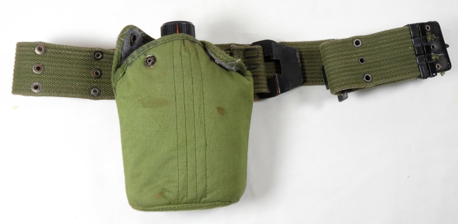 VINTAGE MILITARY CANVAS BELT ALUMINUM CANTEEN: NORMAL WEAR DOES HAVE SOME STAINS, WRITING ON THE INSIDE WITH THE NAME DAN. THE CANTEEN HAS SOME MINOR DINGS AND LOOKS TO HAVE BEEN SOLDER BACK.
