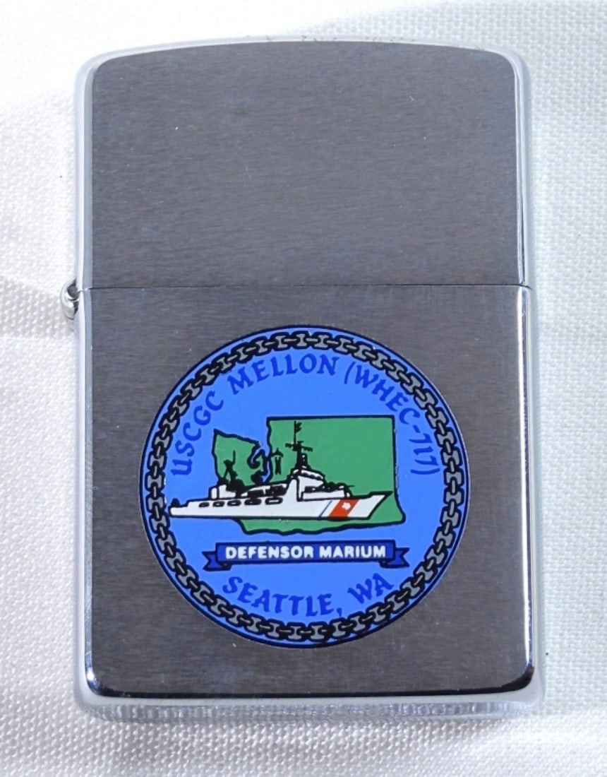 UNFIRED 1989 USCGC MELLON (WHEC-717) ZIPPO: UNFIRED, IN A ZIPPO CASE, WITH THE USCGC MELLON DEFENSOR MARIUM SEATTLE WA LOGO ON THE FRONT