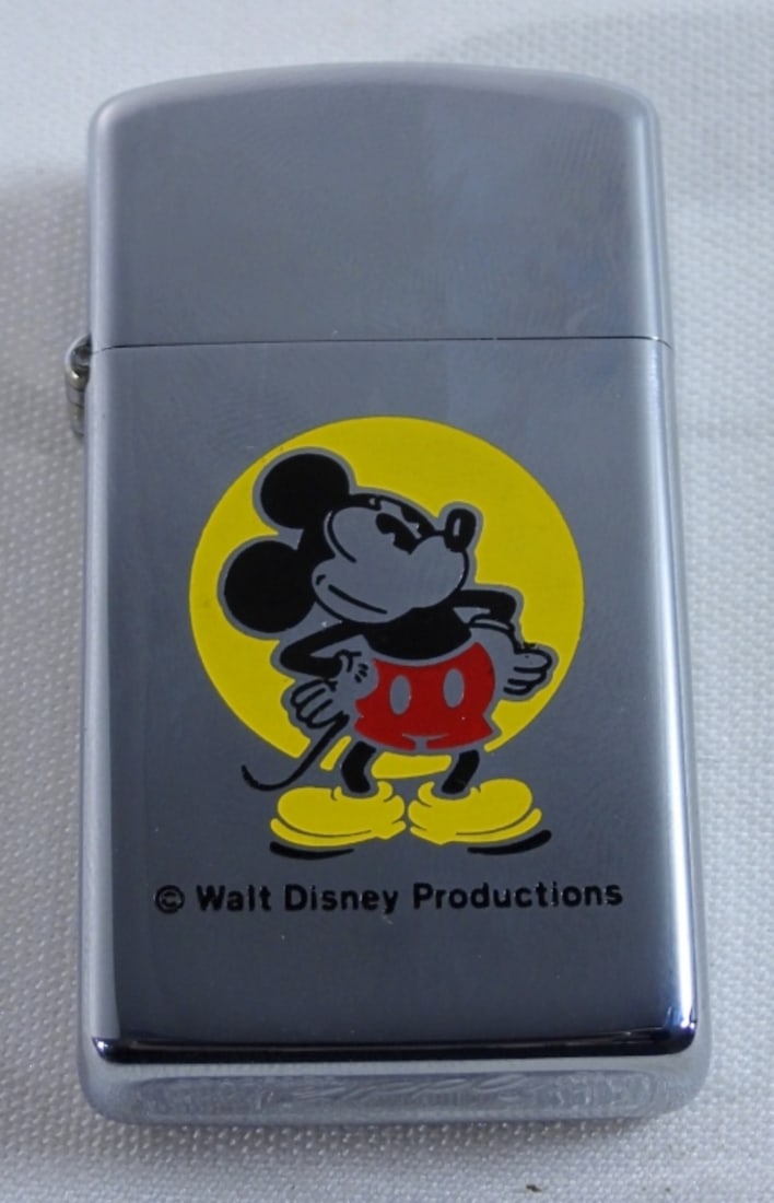 1975 UNFRIED MICKEY MOUSE ZIPPO: UNFIRED, 1975 IN ORIGINAL ZIPPO BOX, BOX DOES HAVE SOME WRITING ON THE BOTTOM