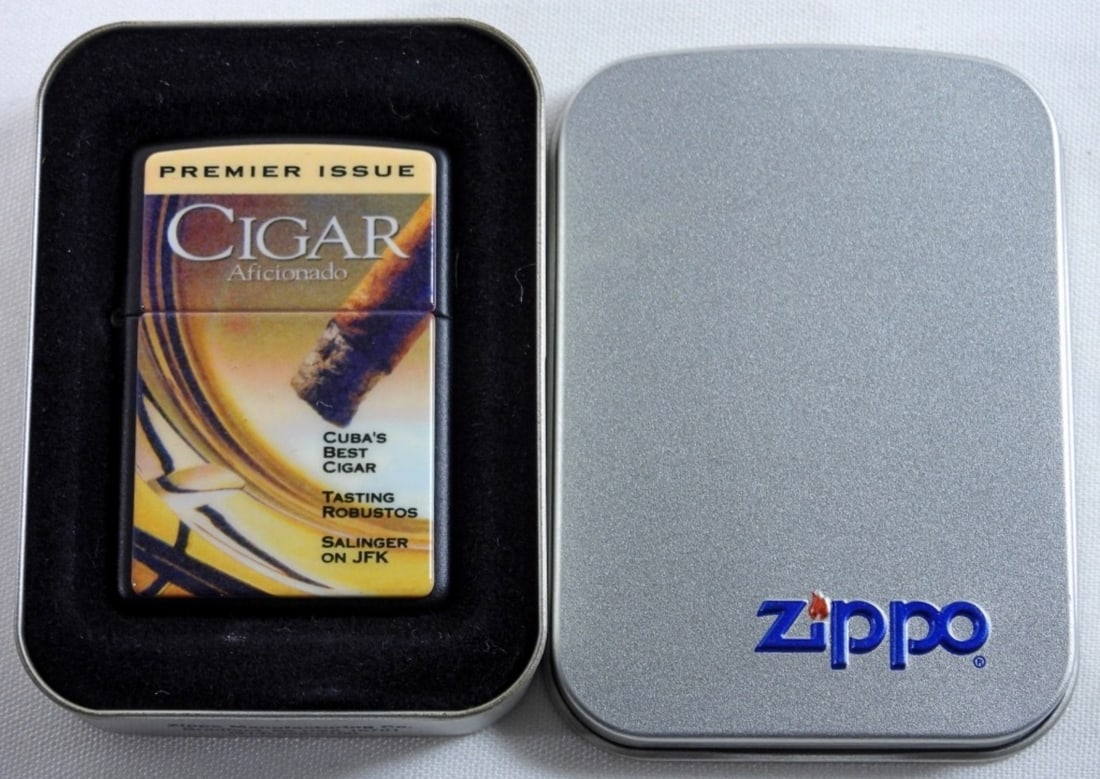 1996 SEALED CIGAR AFICIONADO ZIPPO: IN ITS ZIPPO TIN CASE, CIGAR AFICIONADO LOGO ON THE FRONT