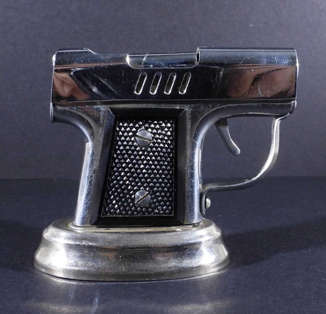 OCCUPIED JAPAN PISTOL TABLE LIGHTER: VINTAGE PISTOL SHAPED TABLE LIGHTER, MADE IN OCCUPIED JAPAN. CIRCA 1945-1952. 2.5" TALL, 2 3/4" WIDE.