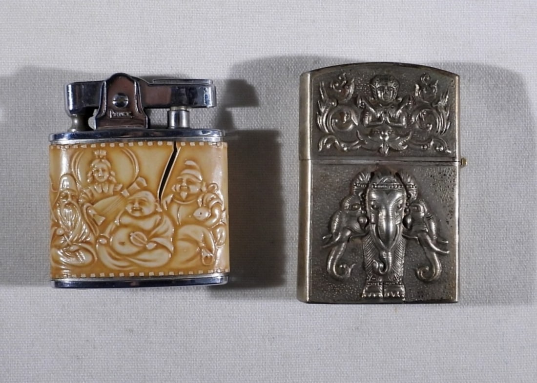 SIAM STERL & VTG PRINCE BUDDHA LIGHTERS: SIAM STERLING LIGHTER (15.9 DWT SHELL ONLY WEIGHED). VINTAGE "PRINCE" BUDDHA SCENE LIGHTER.
