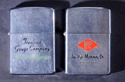 (2) FIRED ADVERTISING ZIPPO PAT PENDING.