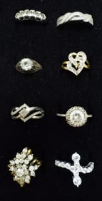 (8) STERLING DIAMOND LIKE RINGS