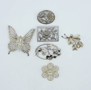 LANG 925 FAIRY PIN & MORE: LANG STERLING FAIRY BROOCH, 2.5" x 2". LEAF BROOCH MARKED "STERLING HS DENMARK", 2". TWO STERLING MARCASITE BROOCHES, 1.5" & 2". TWO OTHER STERLING BROOCHES, 1.5" & 2". (34.3 DWT)