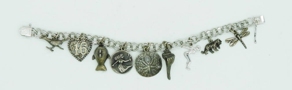 VTG STERLING CHARM BRACELET -9 CHARMS: VINTAGE STERLING CHARM BRACELET WITH NINE CHARMS. 8" (29.1 DWT)
