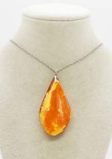 EGG YOLK AMBER PENDANT STERLING CHAIN: LARGE EGG YOLK AMBER PENDANT, 2.5" LONG. ON A STERLING 20" CHAIN. (2 DWT)